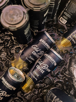 Cold Brew Cans laying in a bath of ice | Ragamuffin Coffee